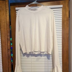 Cropped white top with bell sleeves